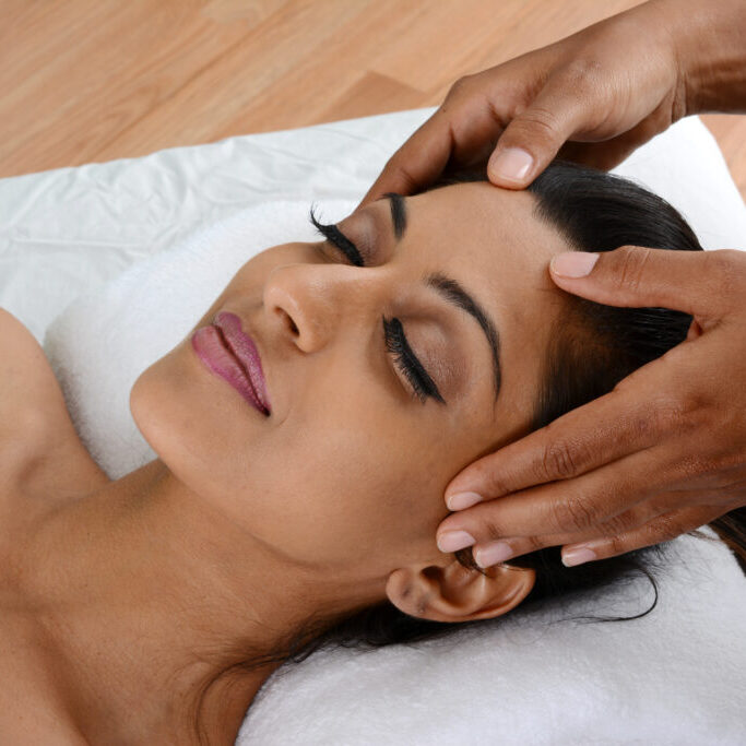 Woman getting a getting relaxing massage in salon